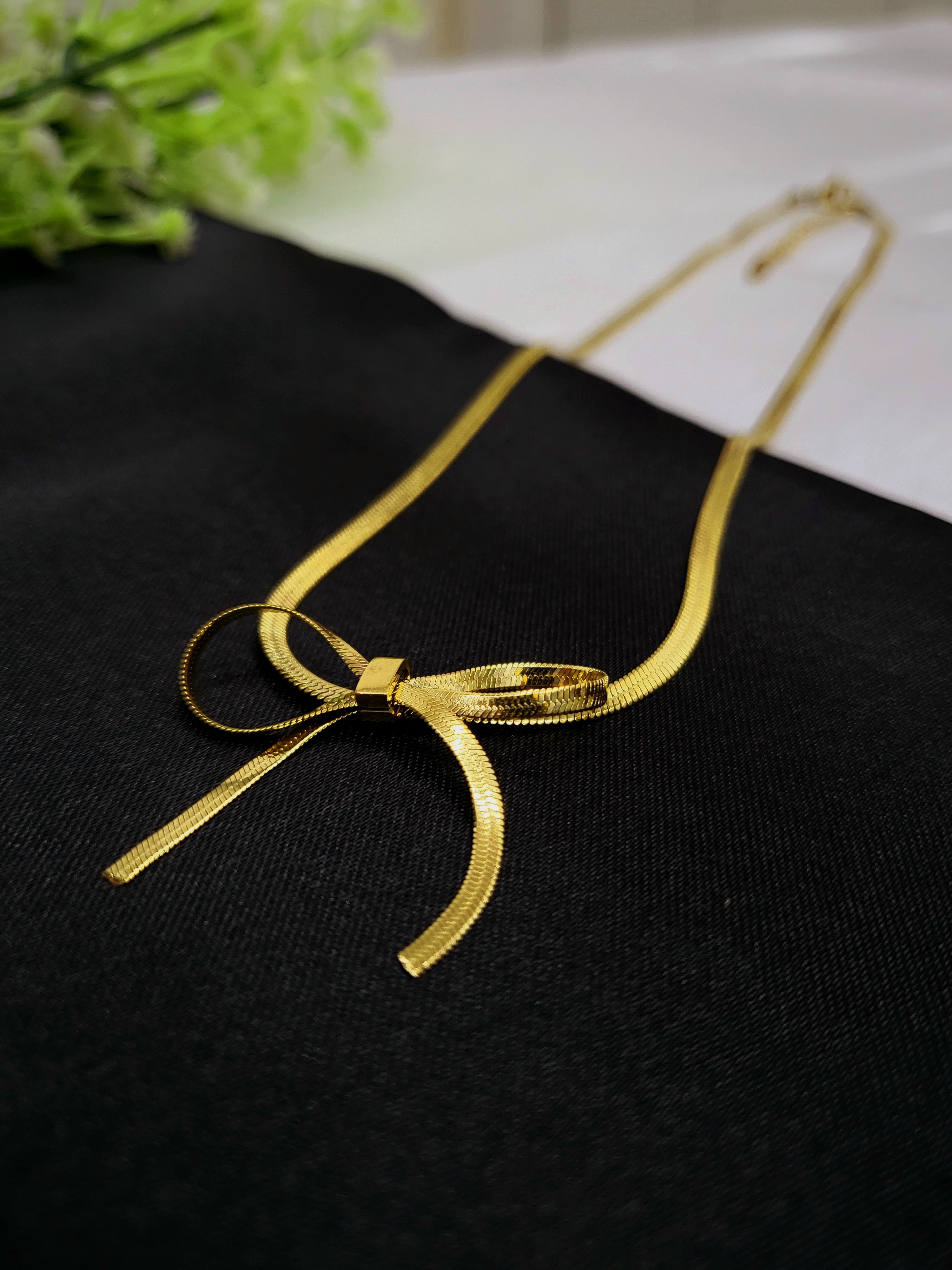 Celene Bow Necklace in 18KT Stainless Steel Gold Plating | Flat Chain with Signature Knot