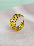 Vespera adjustable anti-tarnish gold plated stainless steel wide ring featuring a three-row parallel beaded bubble design on a soft pink background.